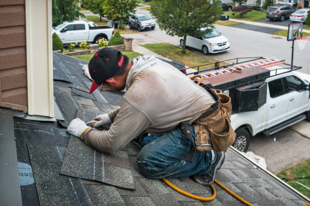 Professional Roofing technician working in Center Moriches, NY